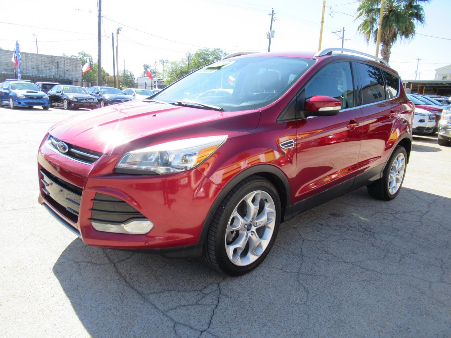 2014 Red /Black Ford Escape Titanium (1FMCU0J98EU) with an 2.0 engine, Automatic transmission, located at 1511 North Shepherd Dr., Houston, TX, 77008, (281) 657-1221, 29.798361, -95.412560 - 2014 FORD ESCAPE TITANIUM VIN: 1FMCU0J98EUA29272 1 F M C U 0 J 9 8 E U A 2 9 2 7 2 4 DOOR WAGON/SPORT UTILITY 2.0L I4 F DOHC 16V GASOLINE FRONT WHEEL DRIVE - Photo#23